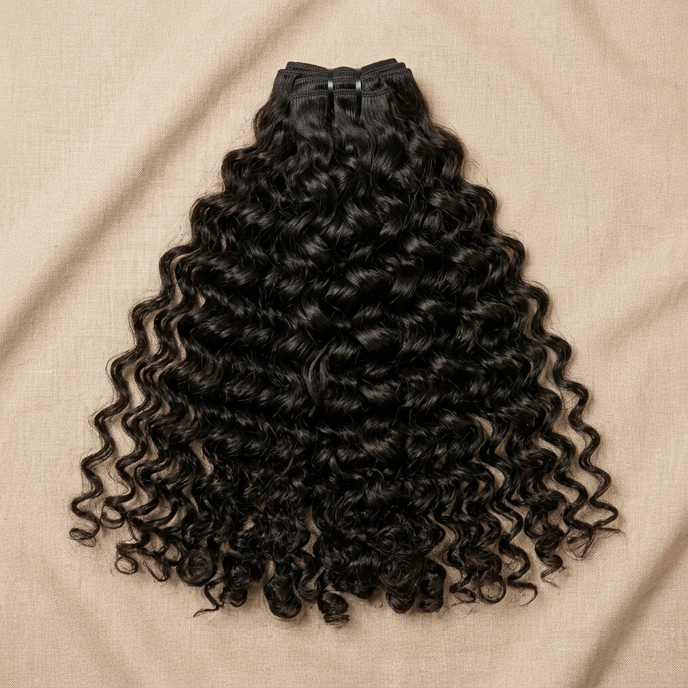 Adéorí Loose Curls virgin hair bundles — 100% human hair flat lay