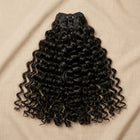 Adéorí Loose Curls virgin hair bundles — 100% human hair flat lay