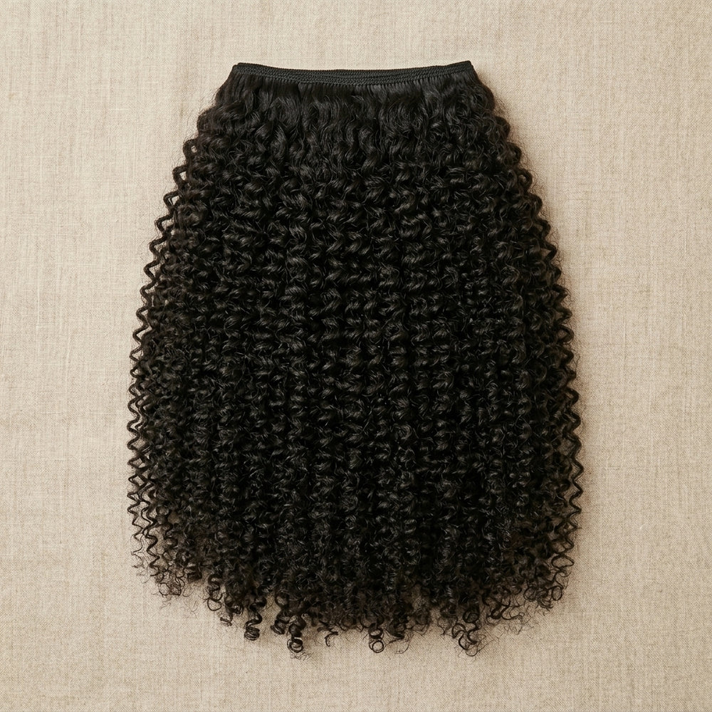 Adéorí 4C Kinky virgin hair extension bundle flat lay on earthy surface