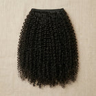 Adéorí 4C Kinky virgin hair extension bundle flat lay on earthy surface
