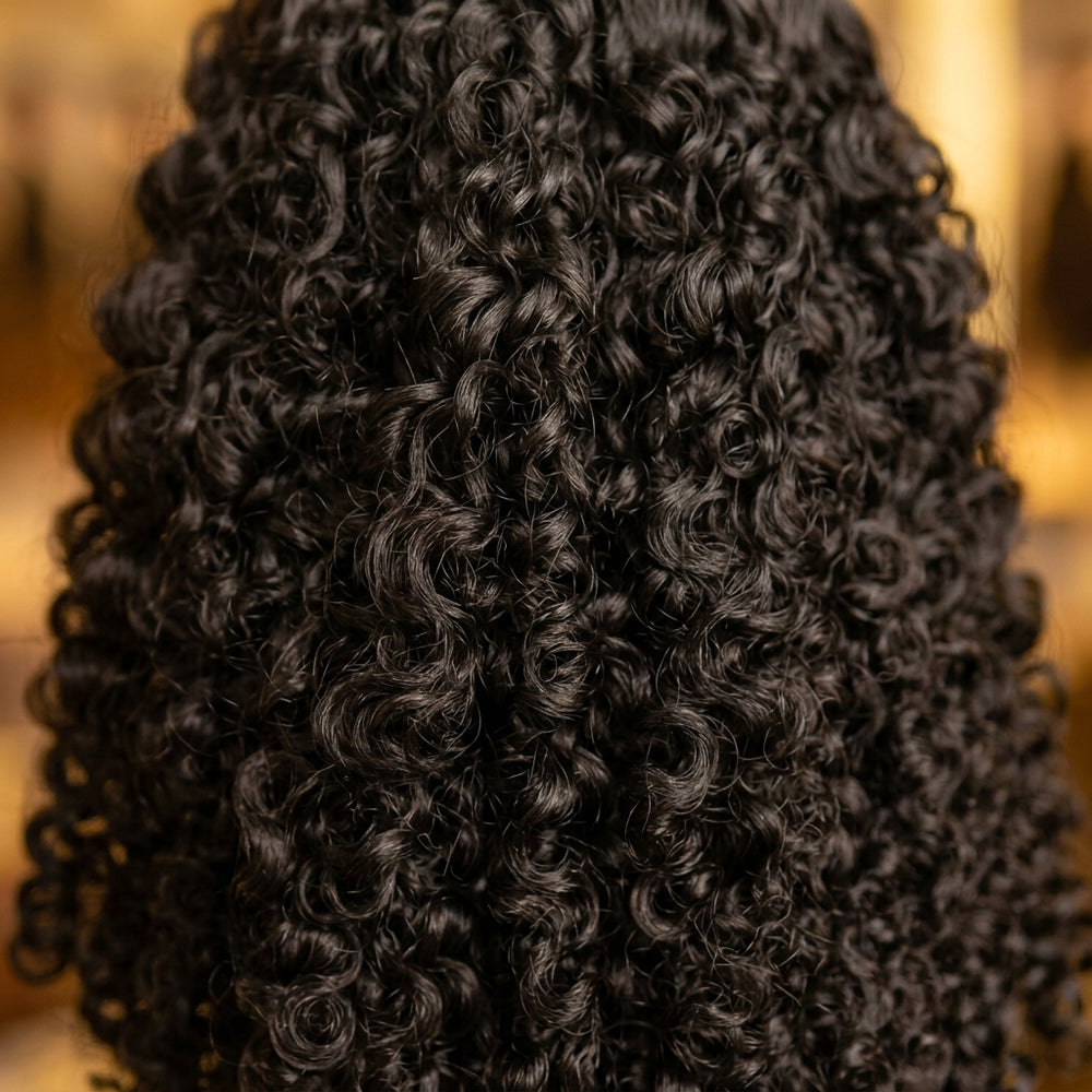 Close-up of Adéorí Burmese Curly virgin hair curl pattern and strand quality