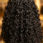 Close-up of Adéorí Burmese Curly virgin hair curl pattern and strand quality