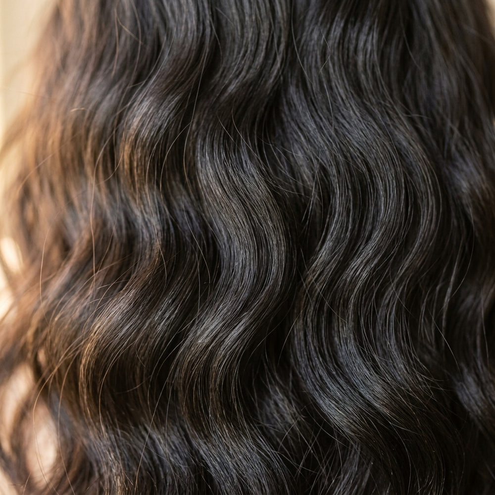 Close-up of Adéorí Loose Wave virgin hair curl pattern and strand quality