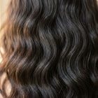 Close-up of Adéorí Loose Wave virgin hair curl pattern and strand quality