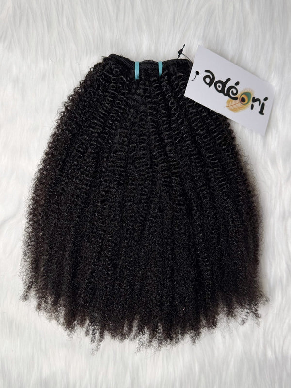 Adé - 4C Kinky Coily weft, fanned to show the full coil pattern