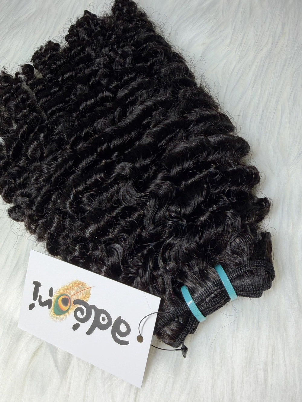 Ìlẹ̀kẹ̀ - Loose Kinky Curly weft, close detail with machine track