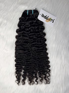 Ìtura - Loose Curly, 3A–3B weft, fanned to show the soft S-curl