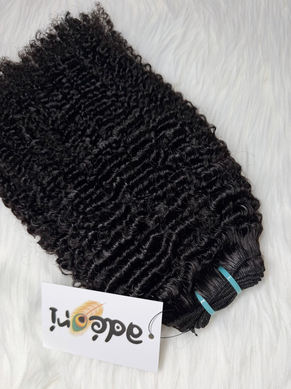 Ọ̀yàyà - Tight Kinky Curly, 4A weft, close detail with machine track